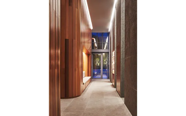 a living room with furniture and a book shelf