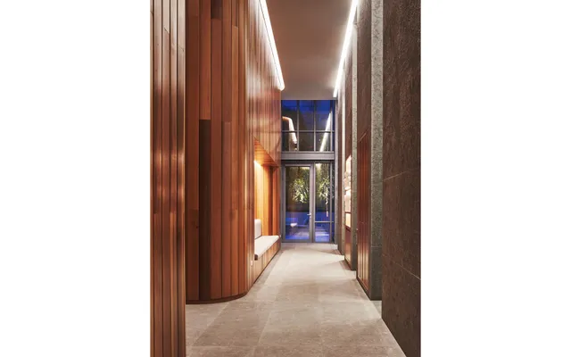 a living room with furniture and a book shelf