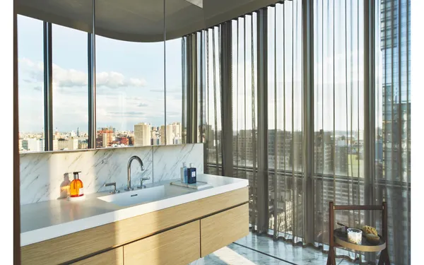 a spacious bedroom with a large bed and a large window