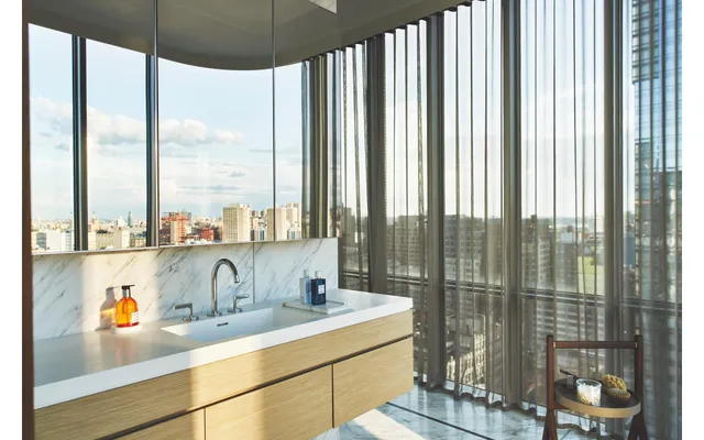 a spacious bedroom with a large bed and a large window