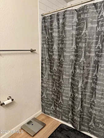 a bedroom with a bed and a television