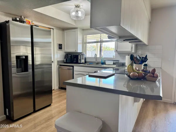 a workspace with furniture and a window