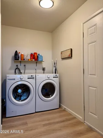 a living room with furniture a rug and a flat screen tv