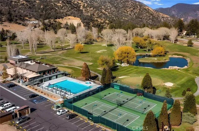 an aerial view of a houses with outdoor space