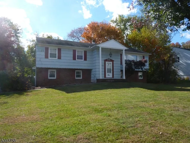 a view of house with yard