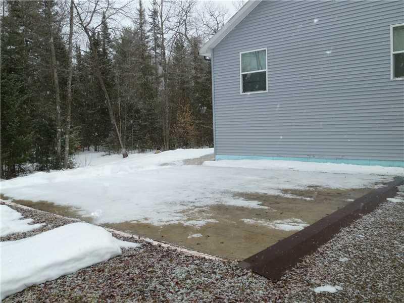 317 Foye Road Wiscasset, ME 04578 - Photo 26 of 35 Parking Lot/Garage. Poured pad with...