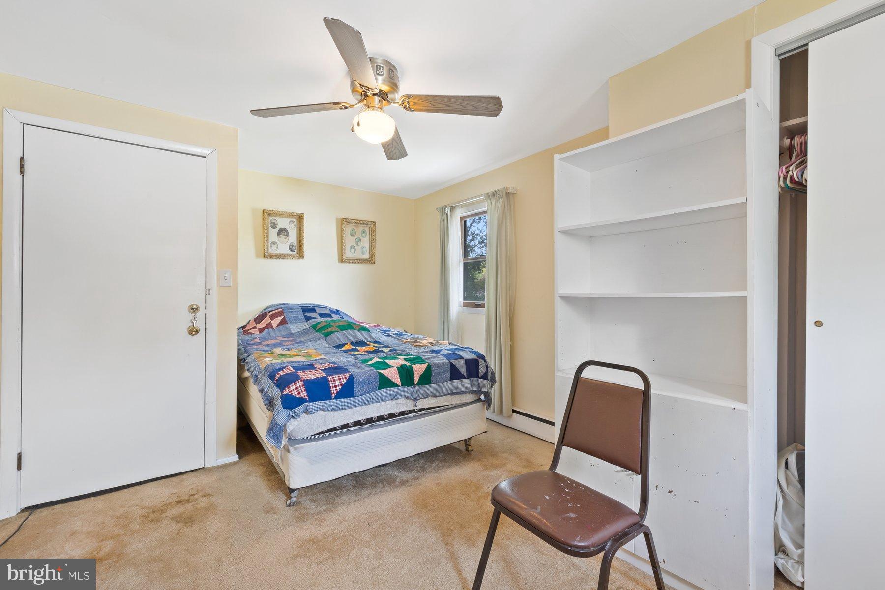 488 Bruce Avenue Odenton, MD 21113 - Photo 23 of 54 a bedroom with a bed a chair and potted plant