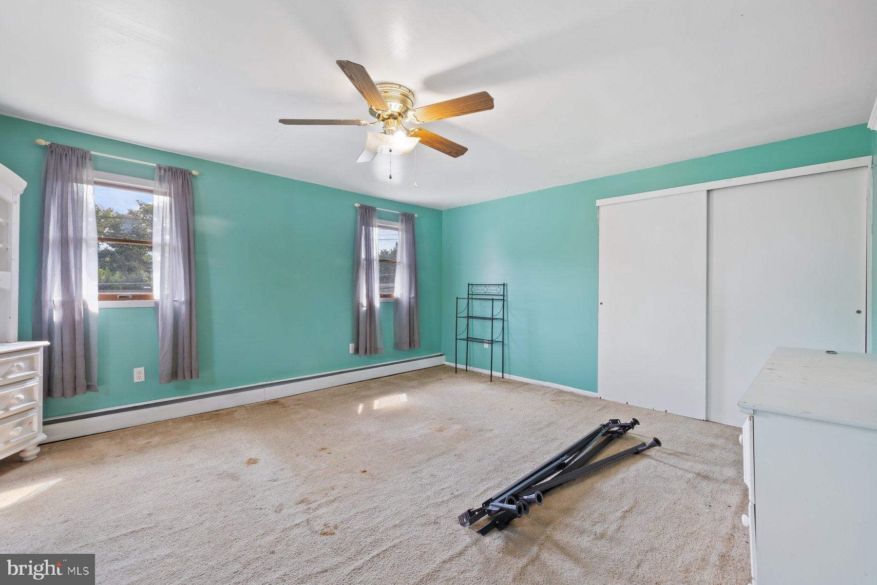 488 Bruce Avenue Odenton, MD 21113 - Photo 29 of 54 a view of a room with a ceiling fan and hardwood floor