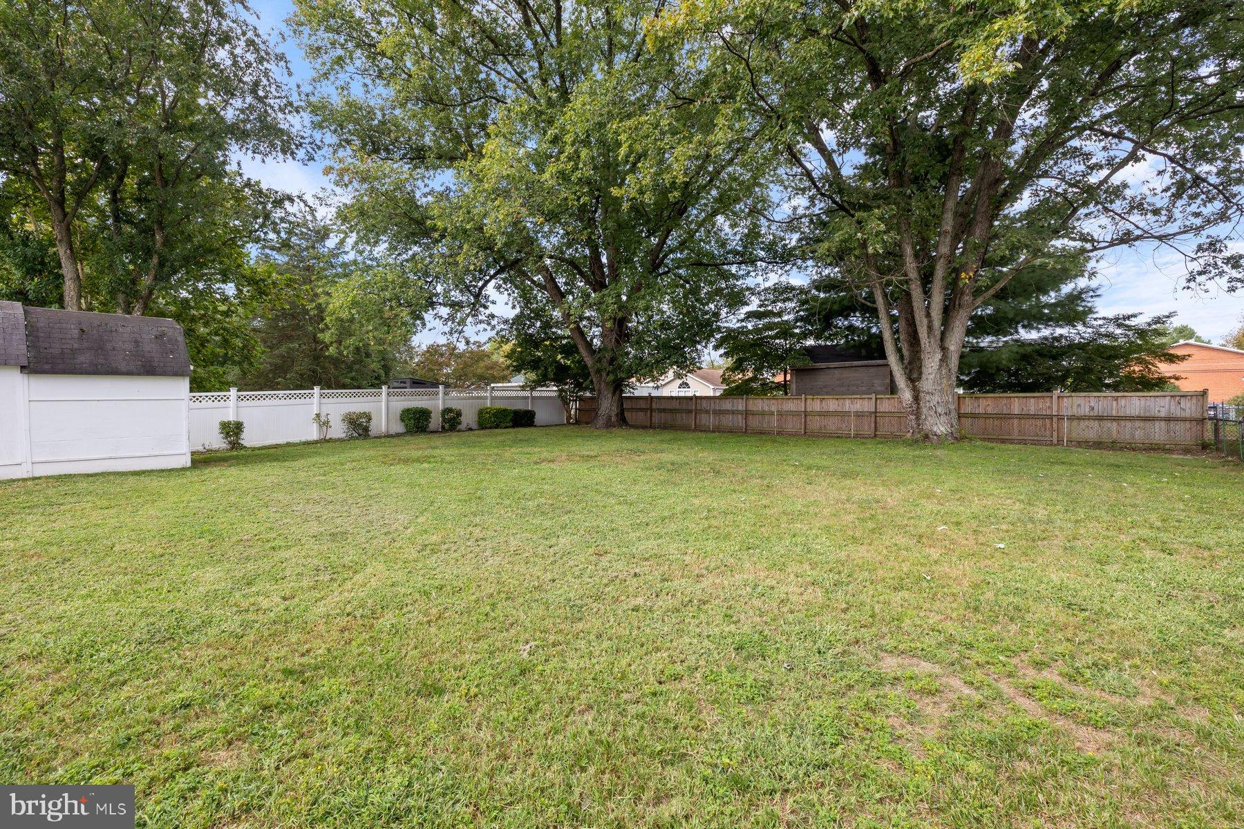488 Bruce Avenue Odenton, MD 21113 - Photo 41 of 54 Spacious backyard with lush greenery.