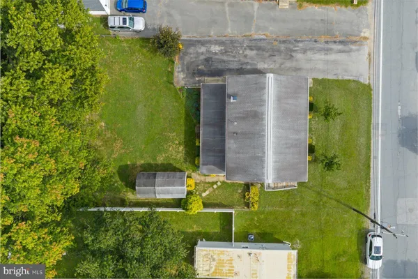 aerial view of a house with a yard