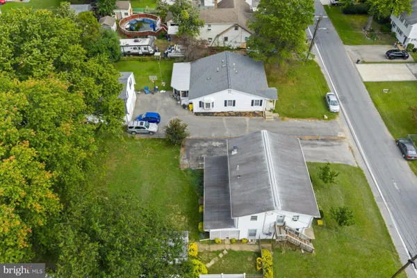 aerial view of a house with a big yard
