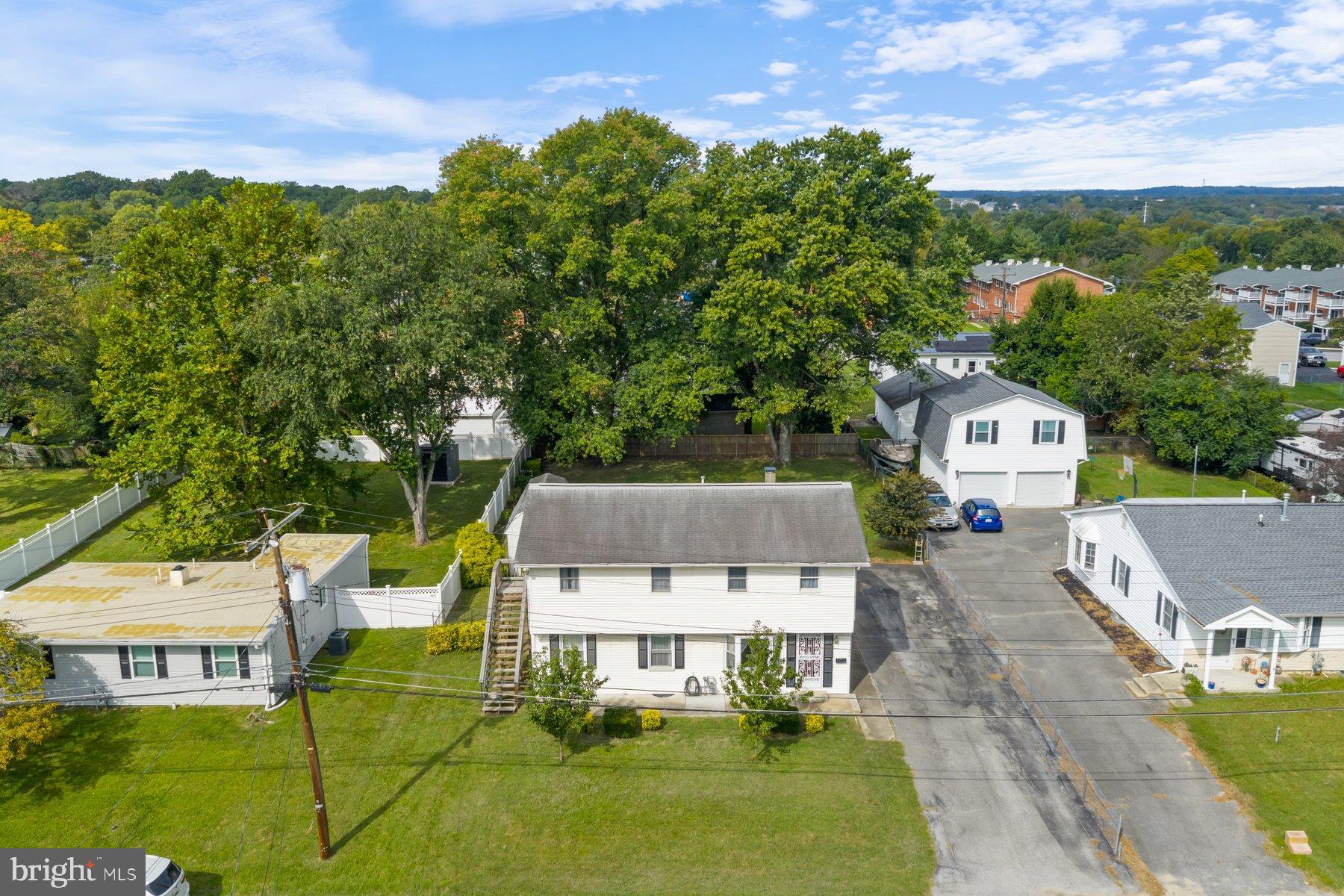 488 Bruce Avenue Odenton, MD 21113 - Photo 46 of 54 an aerial view of a house with garden space and street view
