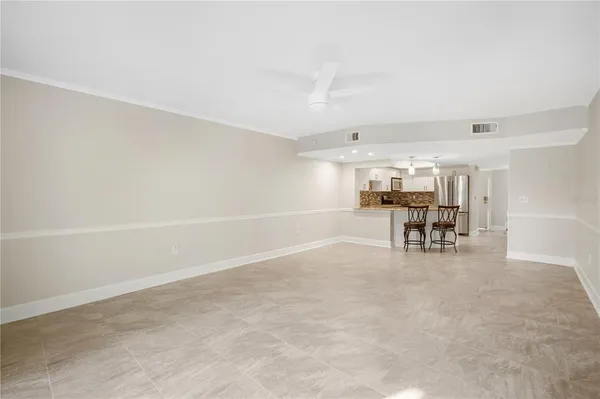 a room with furniture and white walls