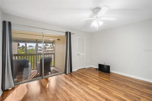 a bedroom with a bed and a large window with outer view