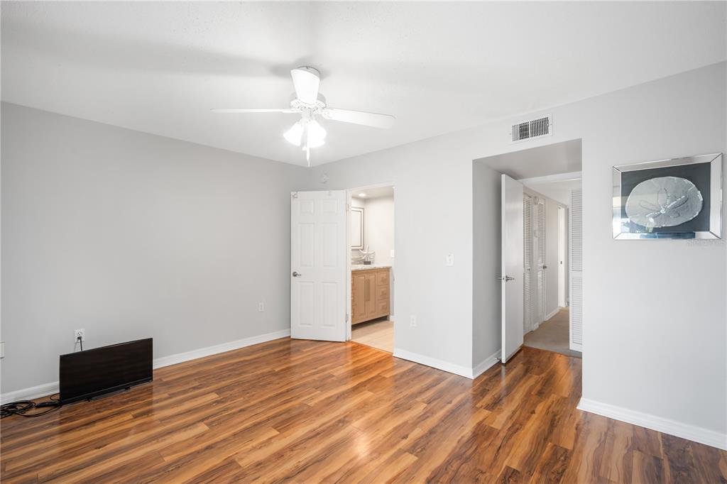 1028 Apollo Beach Boulevard, Unit 17 Apollo Beach, FL 33572 - Photo 15 of 27 a view of a livingroom with wooden floor and closet