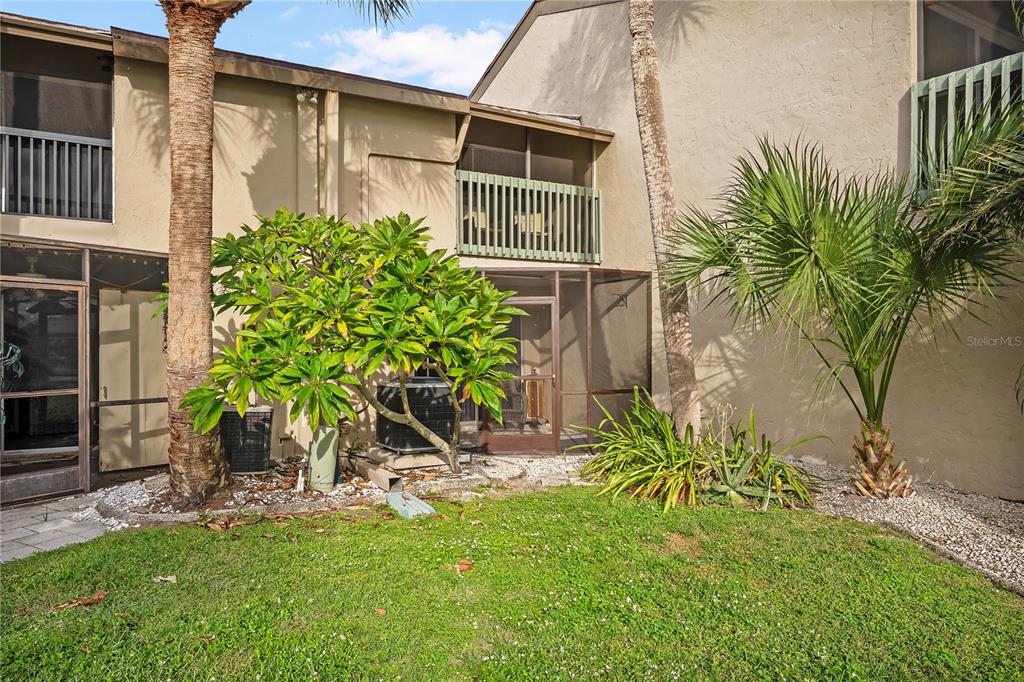 1028 Apollo Beach Boulevard, Unit 17 Apollo Beach, FL 33572 - Photo 19 of 27 a view of a backyard with plants