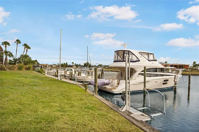 a view of a swimming pool with outdoor seating