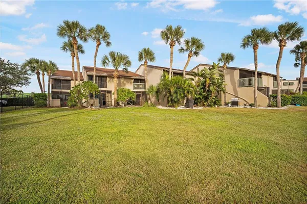 a view of a palm trees in front of a building