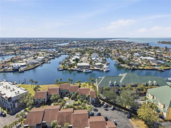an aerial view of a house with a lake view