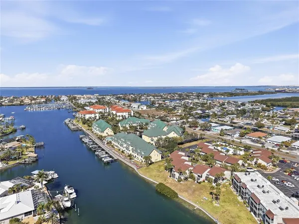 an aerial view of a city with lots of residential buildings in ocean