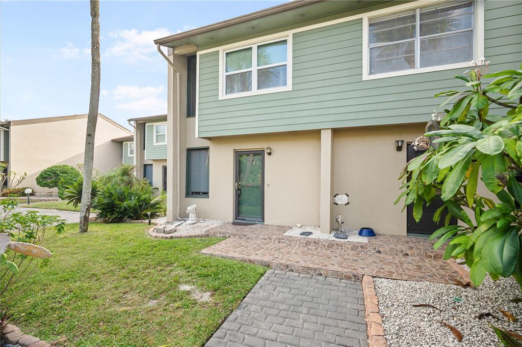 1028 Apollo Beach Boulevard, Unit 17 Apollo Beach, FL 33572 - Photo 3 of 27 a front view of a house with garden