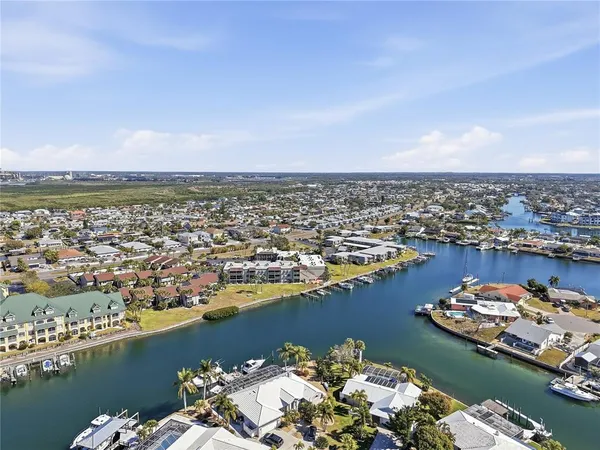 an aerial view of a city with ocean view