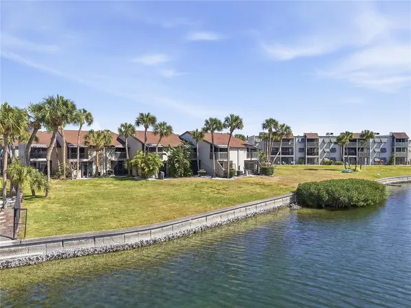 a view of a swimming pool and a yard