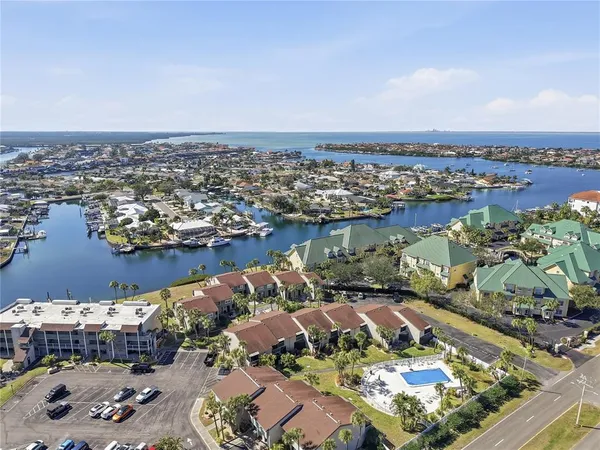 an aerial view of a house with a lake view