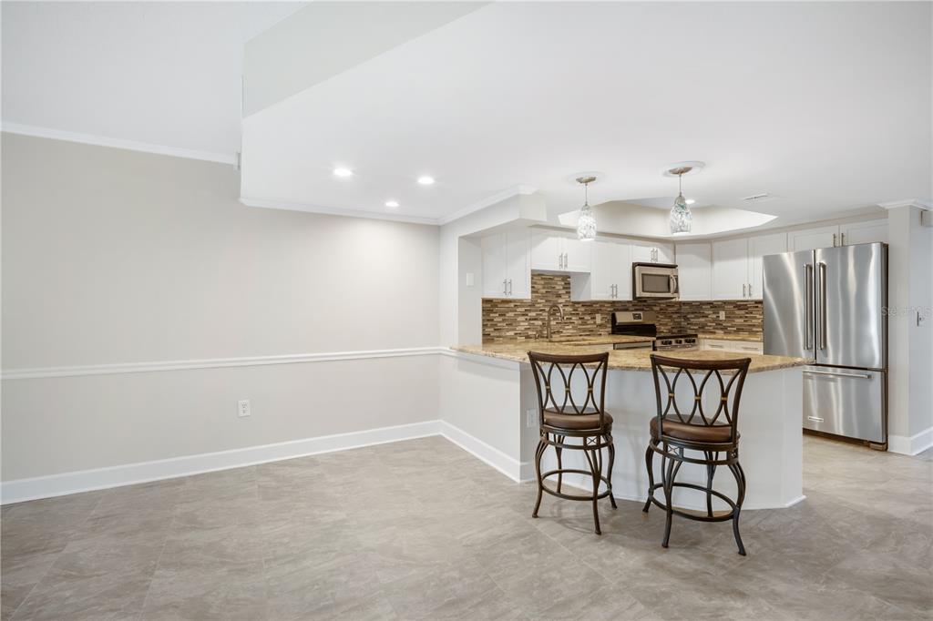 1028 Apollo Beach Boulevard, Unit 17 Apollo Beach, FL 33572 - Photo 8 of 27 a view of a dining room with furniture