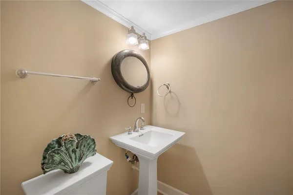 a bathroom with a sink mirror and vanity
