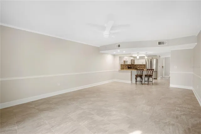a room with furniture and white walls