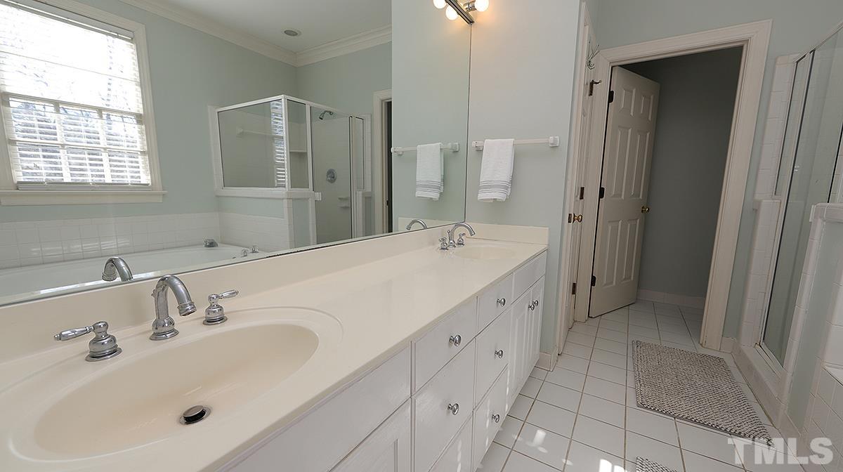 321 Marlowe Road Raleigh, NC 27609 - Photo 12 of 21 a spacious bathroom with double sink a mirror and a shower
