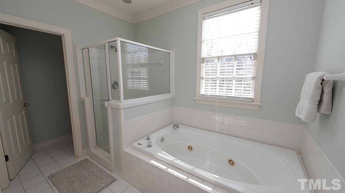 321 Marlowe Road Raleigh, NC 27609 - Photo 13 of 21 a bathroom with a bathtub and a shower