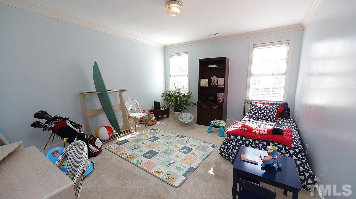 321 Marlowe Road Raleigh, NC 27609 - Photo 15 of 21 a bedroom with bed and a window