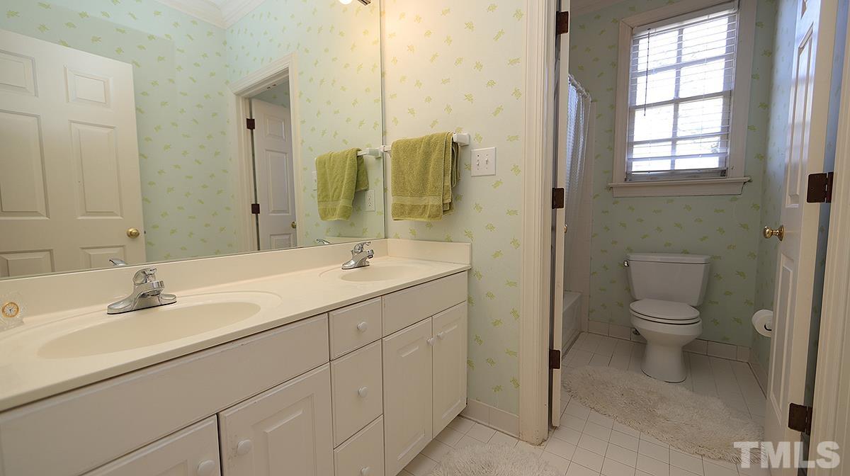 321 Marlowe Road Raleigh, NC 27609 - Photo 16 of 21 a bathroom with a toilet sink and mirror