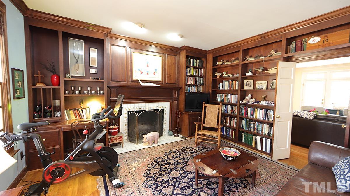 321 Marlowe Road Raleigh, NC 27609 - Photo 4 of 21 a living room with furniture a flat screen tv and a fireplace