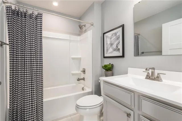 a bathroom with a sink a toilet and a bathtub