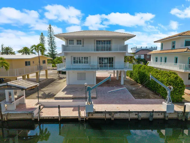 a view of a livingroom and a empty room