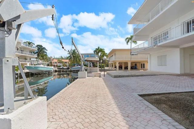 a dining room with furniture and chandelier