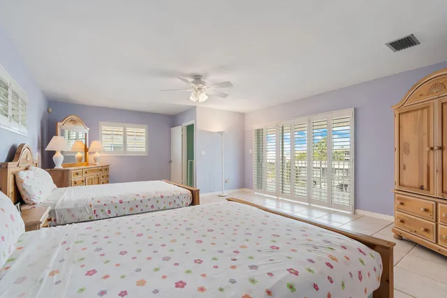 a view of a swimming pool with outdoor seating