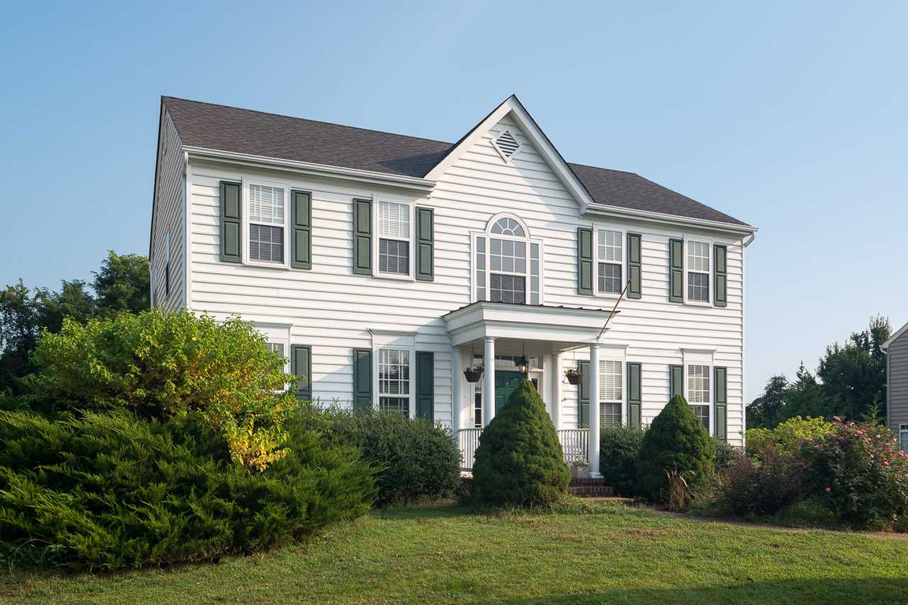 5383 Windy Ridge Road Charlottesville, VA 22903 - Photo 1 of 19 a front view of a house with a yard
