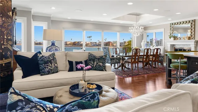 a view of a dining room with furniture and chandelier