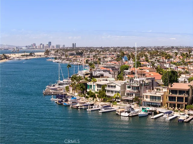 a view of a lake with tall building in the back