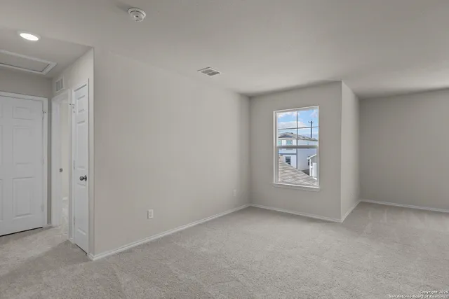 an empty room with windows