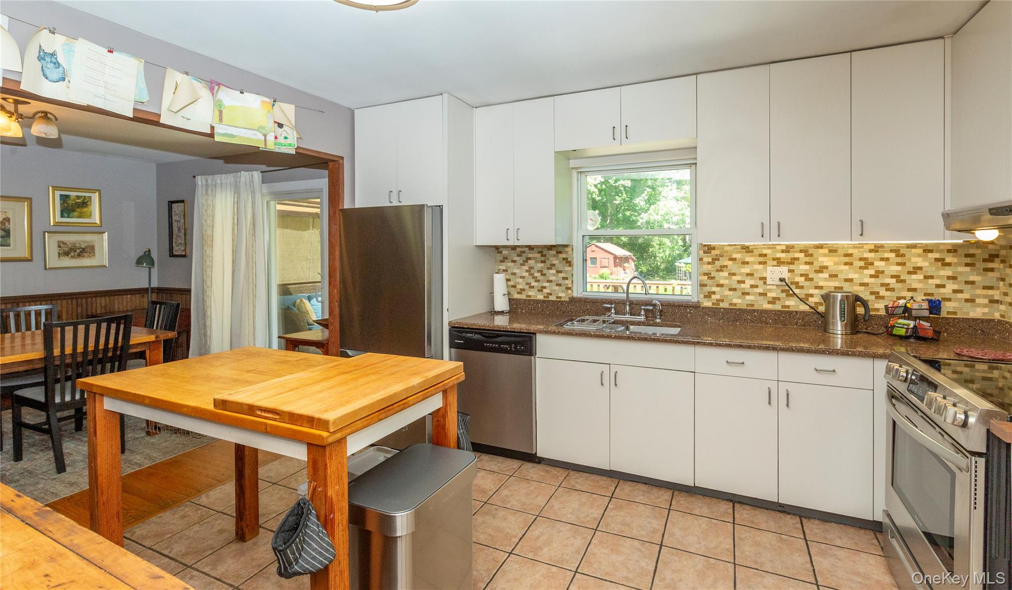 32 Cobb Road Brewster, NY 10509 - Photo 22 of 49 a kitchen with stainless steel appliances granite countertop a sink and a refrigerator