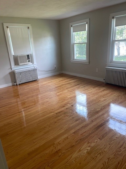 30 Wilbraham Road Monson, MA 01057 - Photo 4 of 11 an empty room with wooden floor and windows