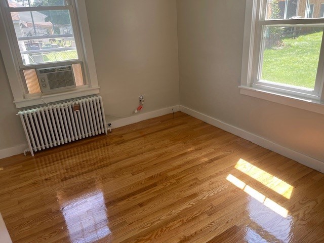 30 Wilbraham Road Monson, MA 01057 - Photo 6 of 11 a view of empty room with wooden floor and fan