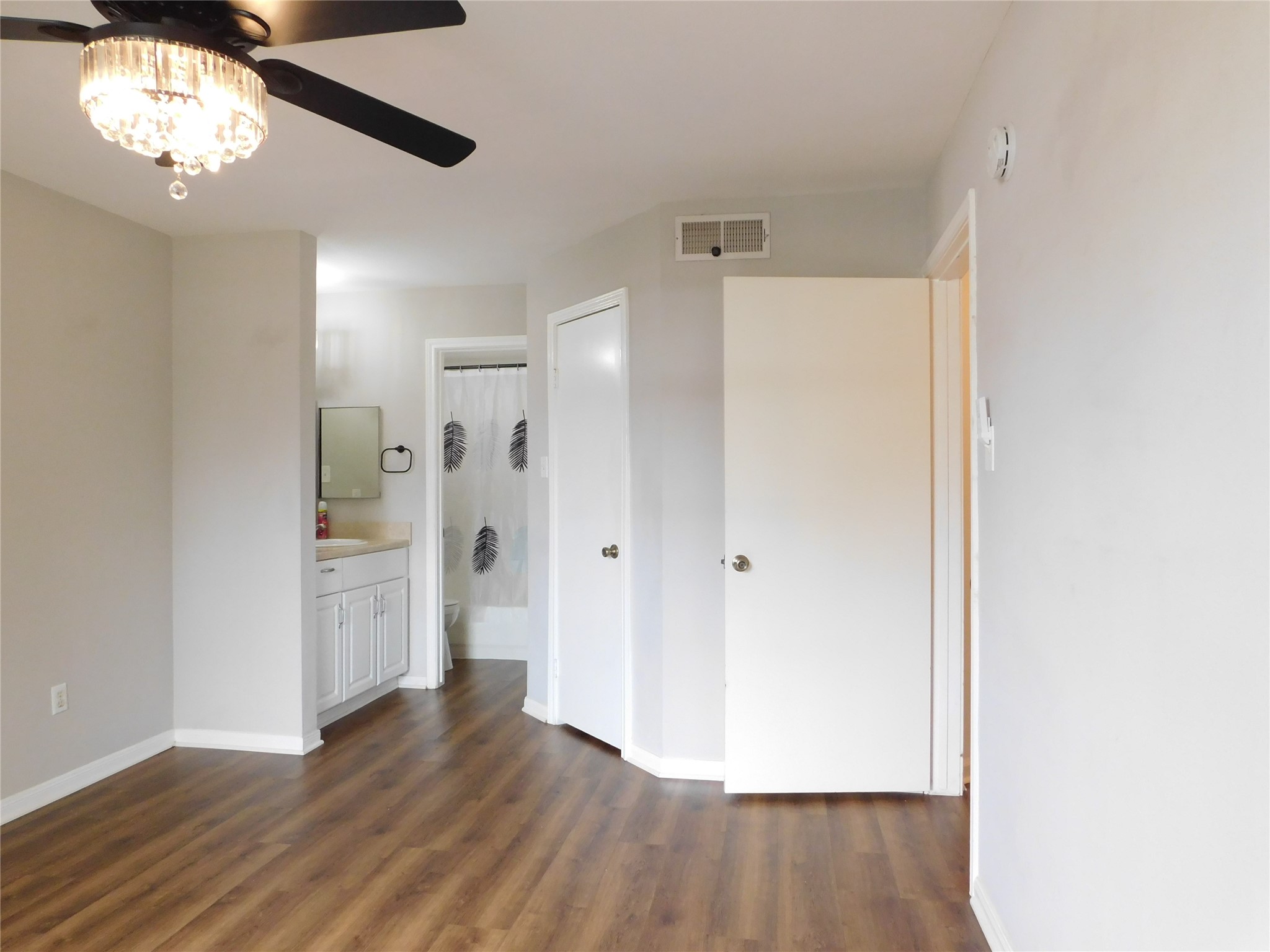 10101 South Gessner Road, Unit 912 Houston, TX 77071 - Photo 17 of 47 a view of an empty room with wooden floor and a window