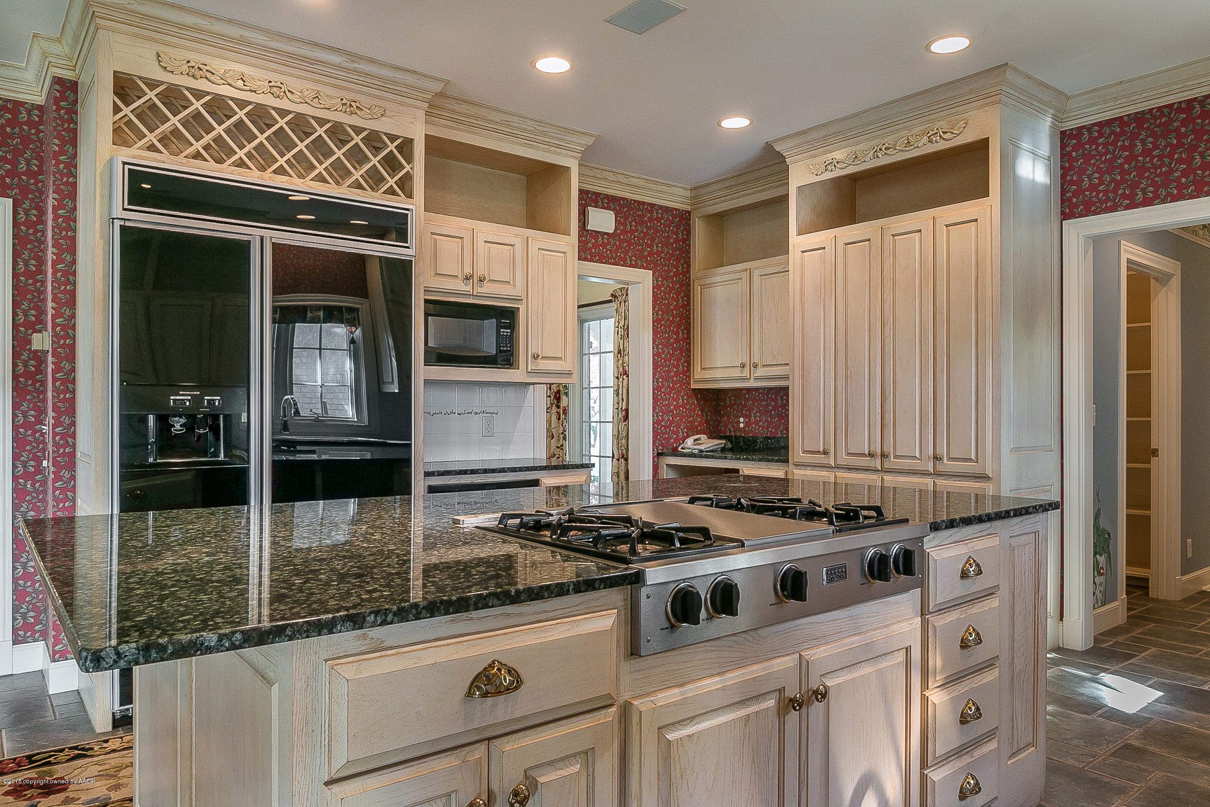 9101 Red Wing Road Amarillo, TX 79119 - Photo 46 of 70 a kitchen with granite countertop cabinets and steel stainless steel appliances