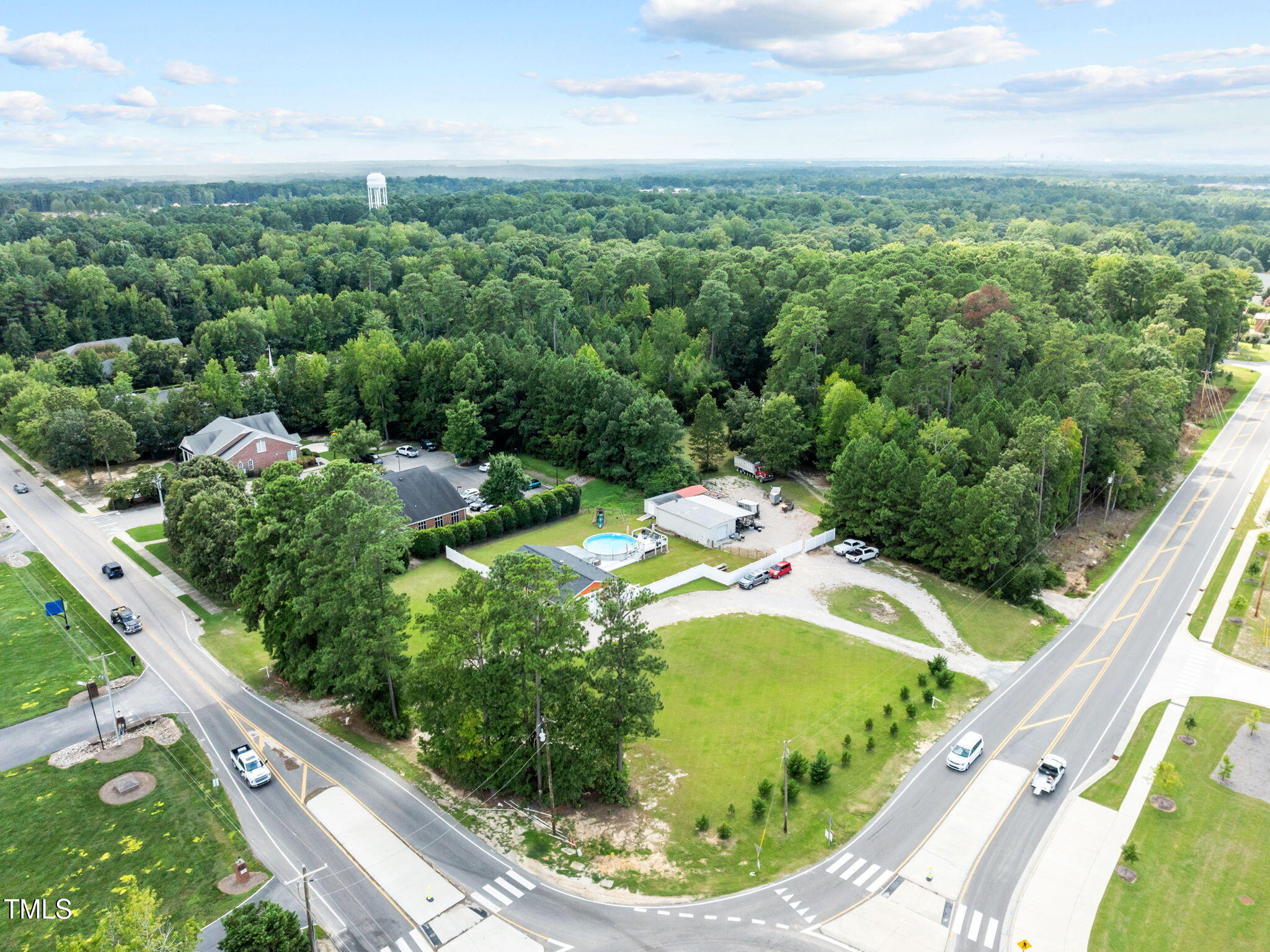 949 Old Knight Road Knightdale, NC 27545 - Photo 13 of 27 a view of a garden with a wooden fence